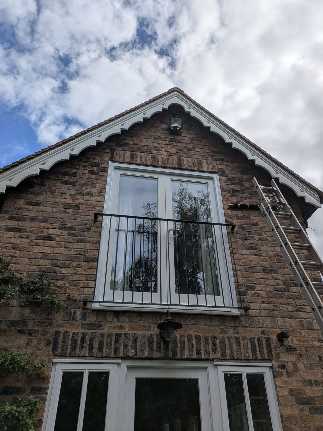 Completed exterior repair and decorative timberwork on a brick house